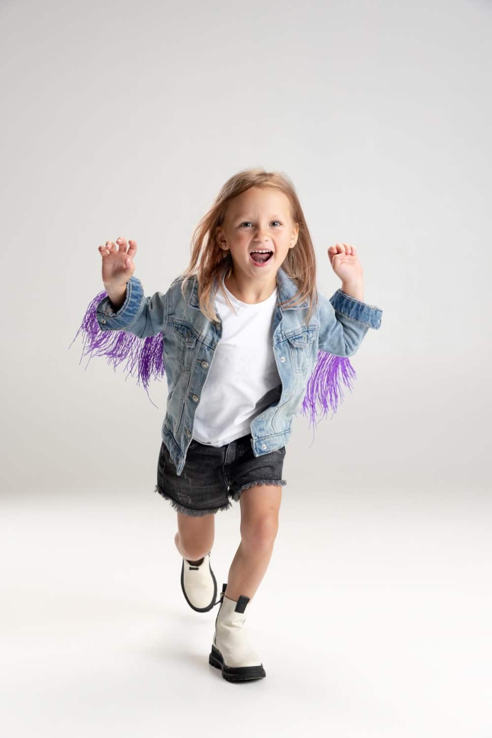 smiling-cute-girl-running-white-studio-background-caucasian-model-with-long-flowing-hair-summer-dress-min